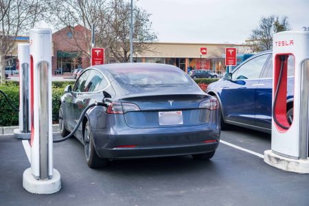 Tesla at a supercharger - Myths About Electric Vehicles