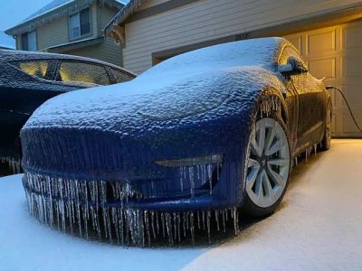 Blue tesla cover in ice - Myths About Electric Vehicles