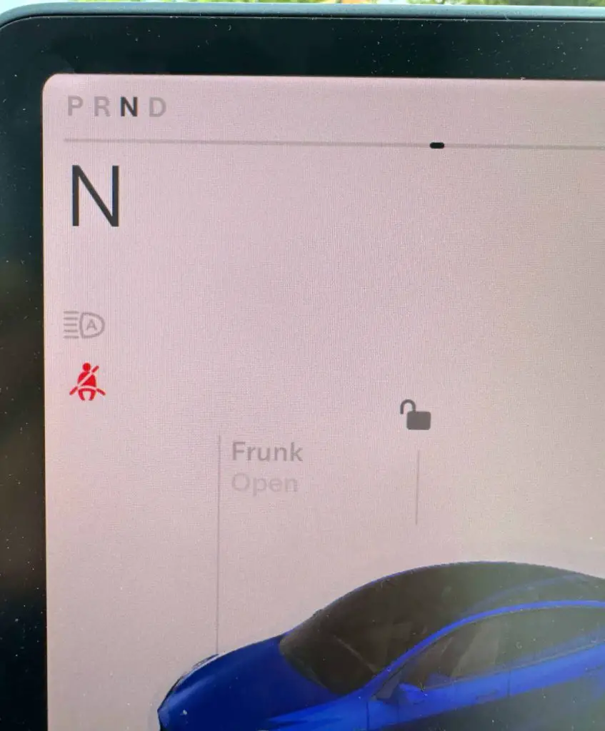 The Tesla touchscreen showing shifting gears and placing the Tesla in neutral